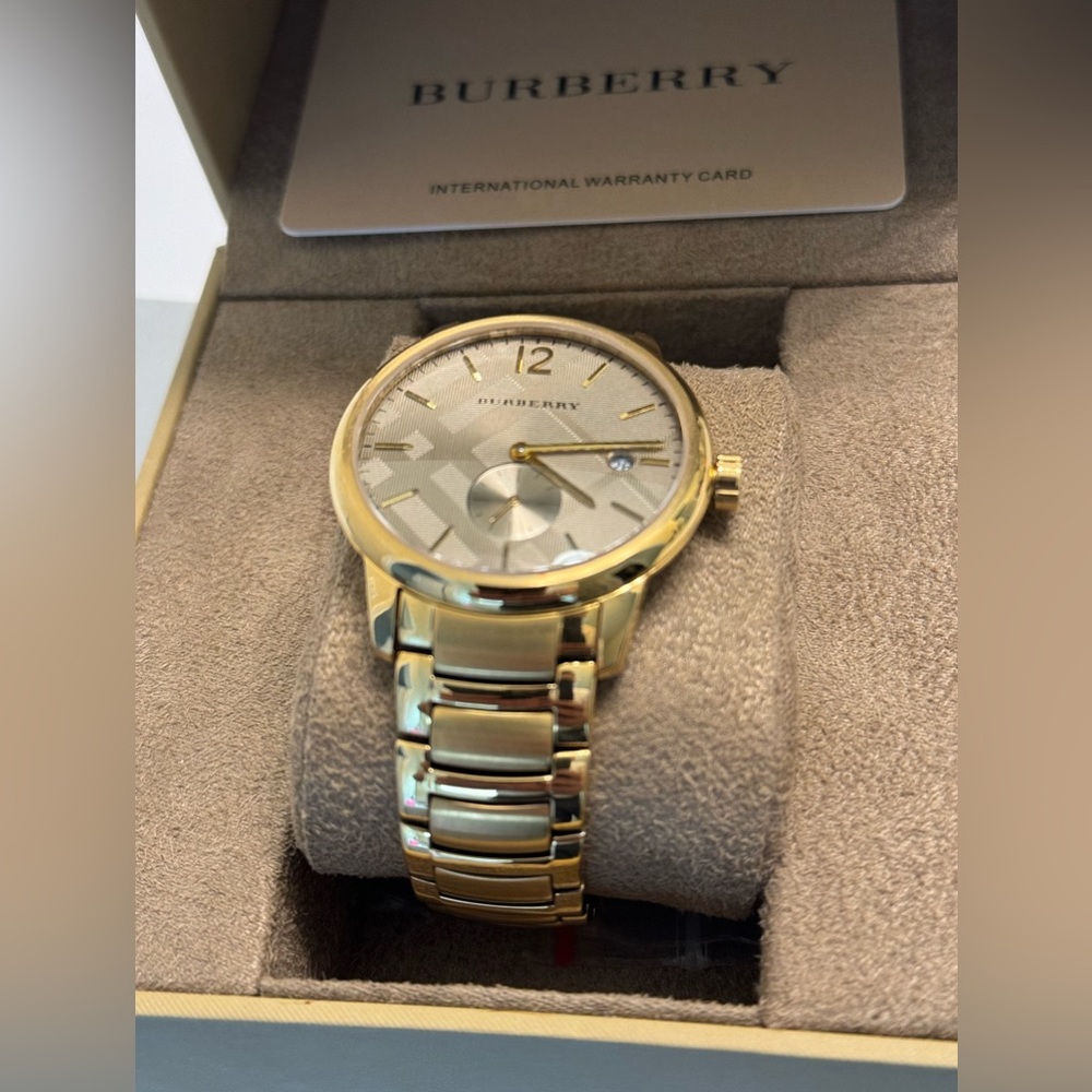 Burberry Gold Watch. Authentic and discontinued. New without tags never worn